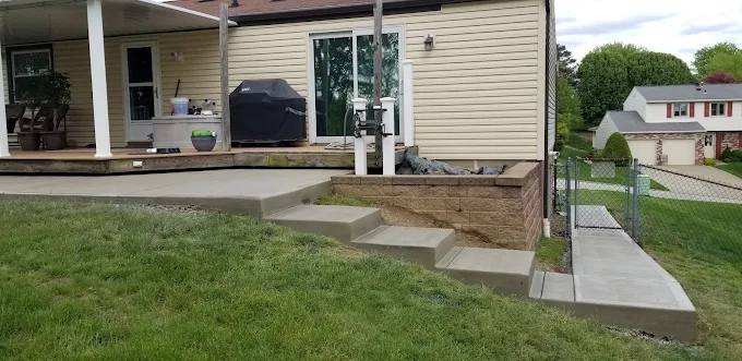 Poured concrete patio, steps and walkway at a residential home